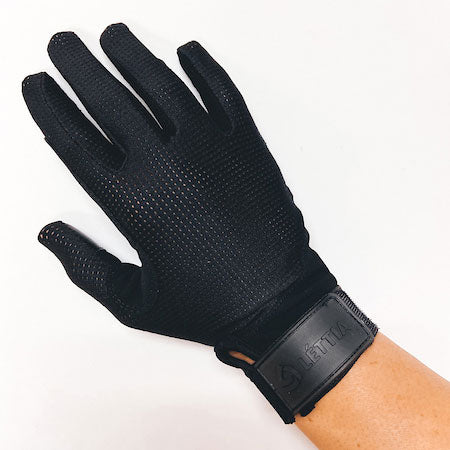 Black mesh riding glove with a perforated back and a wrist strap closure, worn on a hand