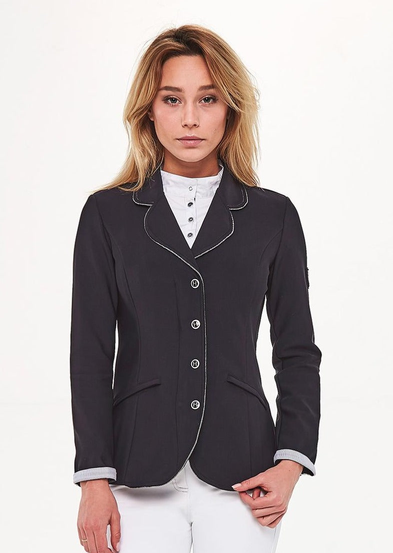 Black competition jacket with light piping, worn over a white show shirt, front view on a model