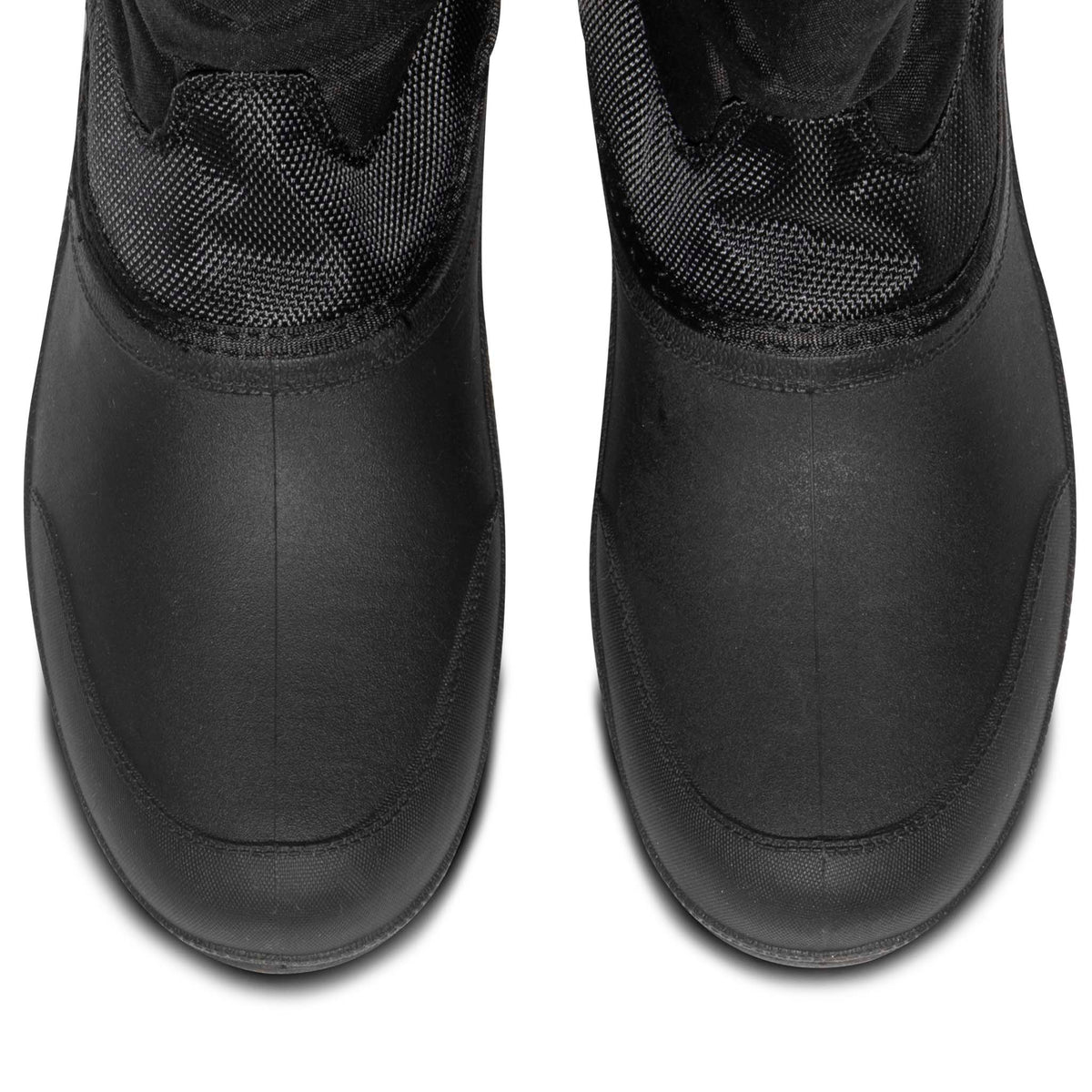 Close-up from above of the smooth black toes on a pair of quilted winter boots