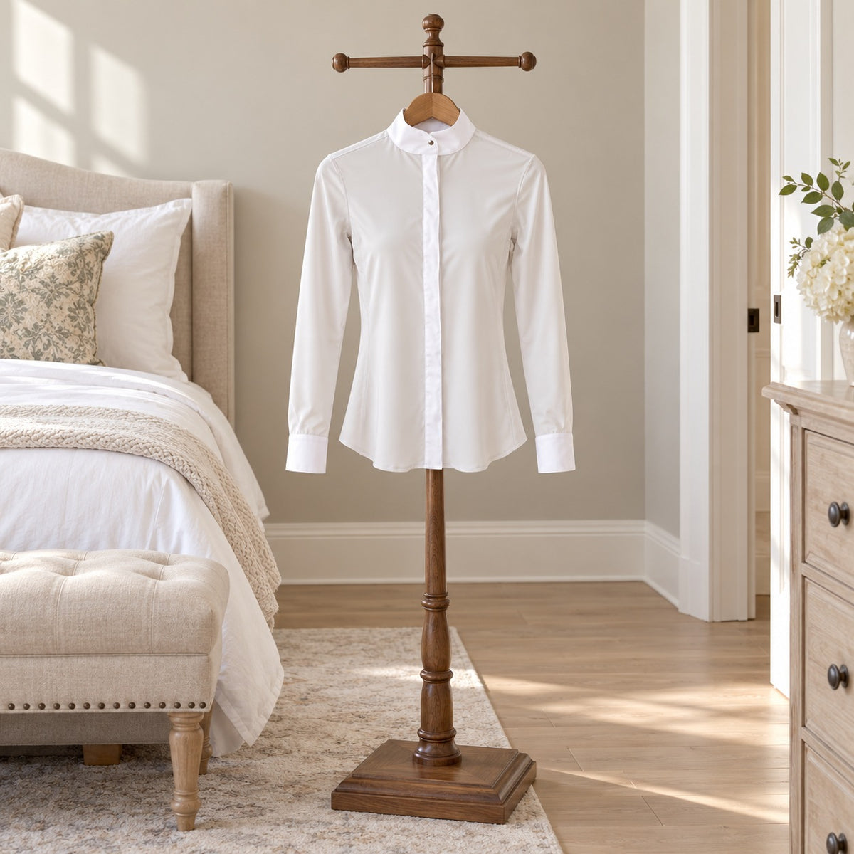White long sleeve show shirt with a band collar on a wooden valet stand in a bedroom