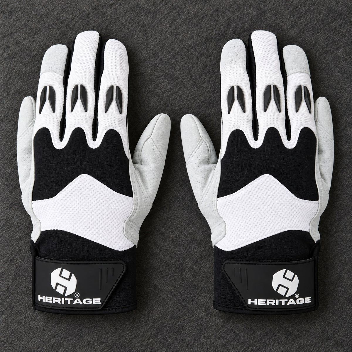 Pair of white and black Heritage Polo Pro gloves on grey felt