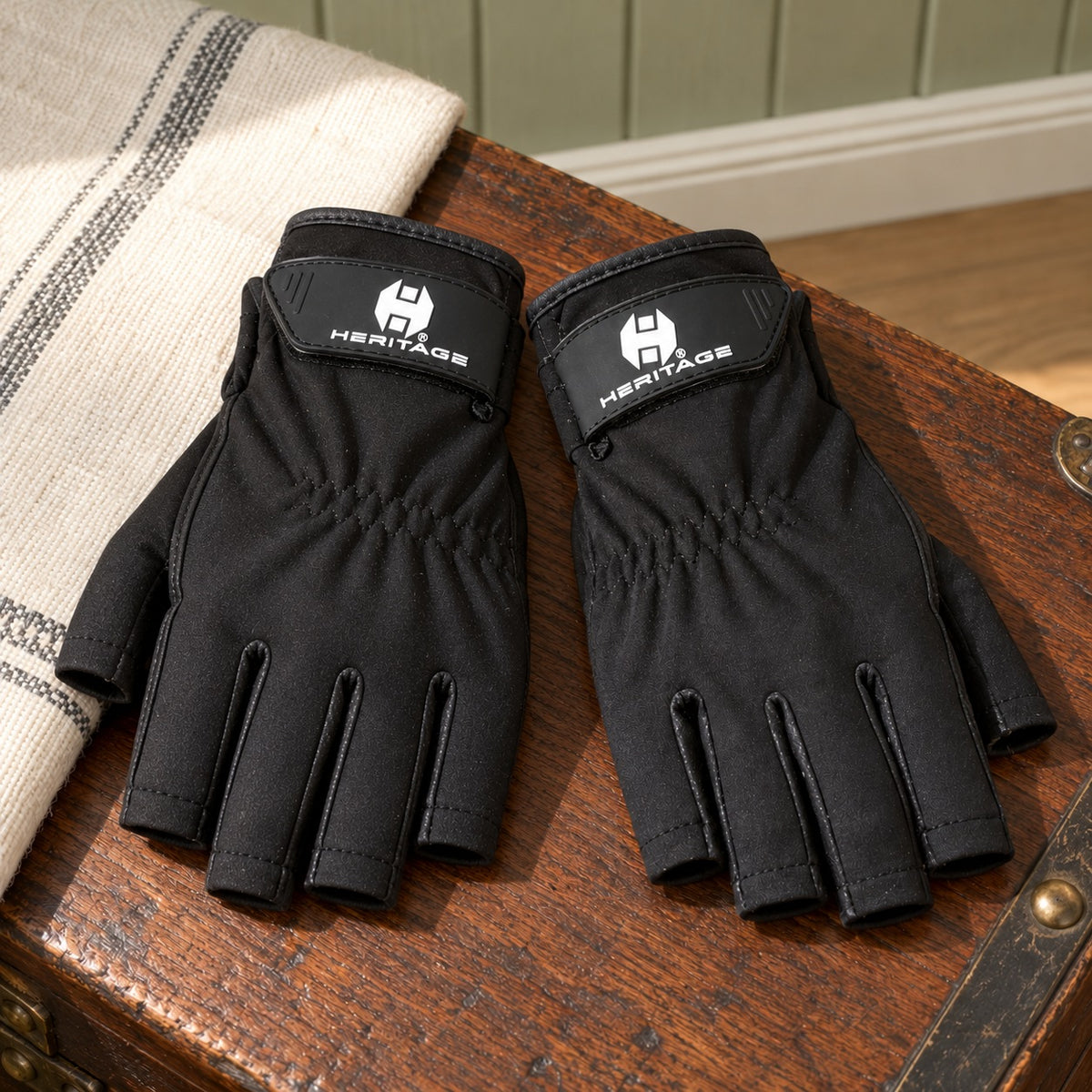 Heritage Tech-Lite Glove pair in black on a tack trunk