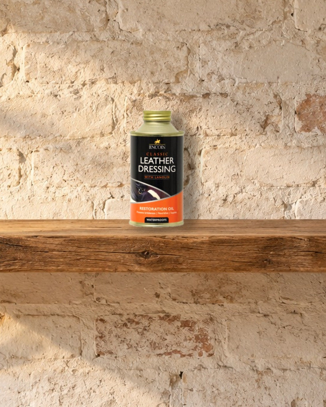 Lincoln Classic Leather Dressing tin on a rough oak shelf against a whitewashed brick wall