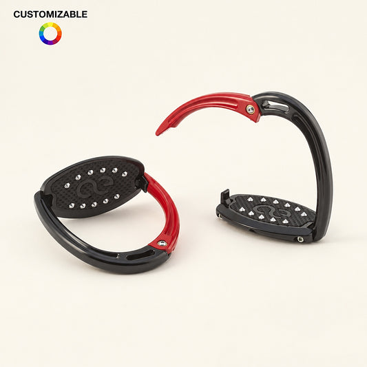 American Equus Elite Escape safety stirrups in black with red release branches on an ivory studio background