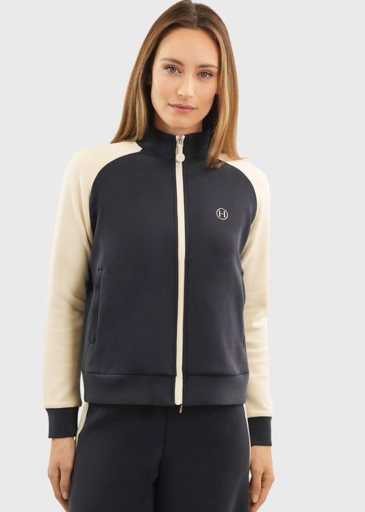 Navy zip-up sweatshirt with cream raglan sleeves and a cream zip, front view on a model